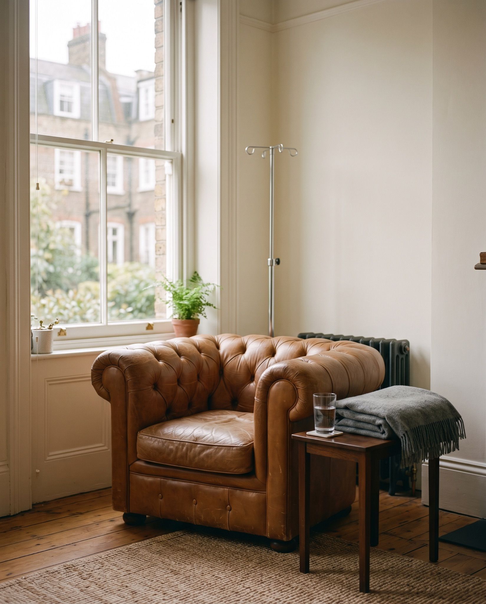 A leather armchair beside a tall window